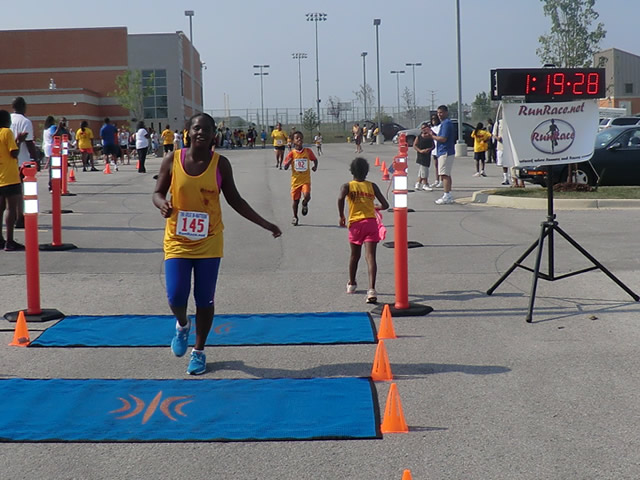 Saturday June 30, 2012 - Runners making the finish of The Great 8K!