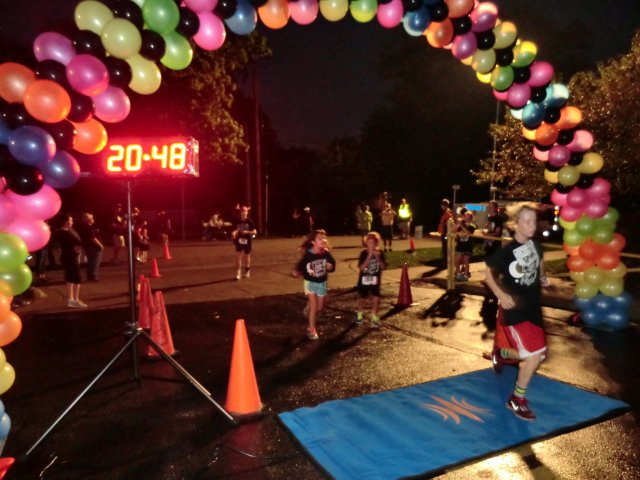 Top participants make their finish line in the inaugural MSW Light Up the Night 5k!