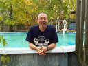 Mark cooling his legs in the pool after running in the Circle 5K