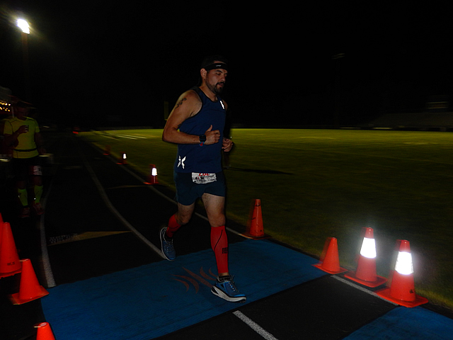 3:50 am... with runners orbiting the track at wildly varying speeds.